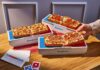 Domino’s Launches Personal Detroit-Style Pizza The Domino is made with premium, buttery-flavored pan dough encrusted with real Parmesan cheese and baked in a rectangular pan to create a crispy Parmesan Detroit-style crust. It is topped with two layers of cheese, customers' choice of sauce and up to three toppings, and finished with a drizzle of Domino's signature garlic seasoning.